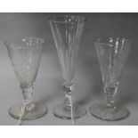 A pair of engraved ale glasses and a taller glass 13cm, 16.5cm