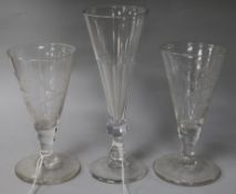 A pair of engraved ale glasses and a taller glass 13cm, 16.5cm