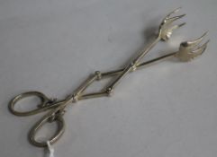 A pair of Cartier sterling silver ice tongs, signed and numbered 2232-1, 18.8cm.