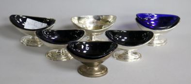 A set of four George III silver boat shaped pedestal salts by Charles Aldridge, London, 1792/3 and a