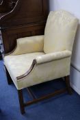 An George III style upholstered armchair