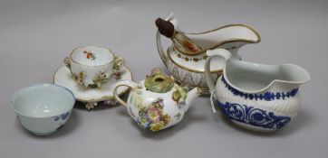 A Meissen floral encrusted cup and saucer, a similar teapot, a Chinese teabowl, two jugs and a scent