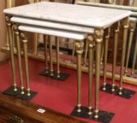 A nest of three marble and brass tables W.51cm