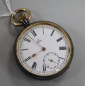 An Omega gun metal open face pocket watch, early 20th century, having white enamelled Roman dial