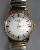 A gentleman's 9ct gold Longines manual wind wrist watch.