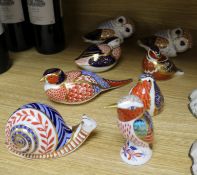 Eight assorted Royal Crown Derby paperweights, modelled as birds and a snail