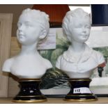 A pair of French Tharaud Limoges busts of children 40cm.