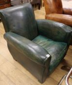 A 1930's French green leather armchair