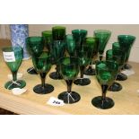 Sixteen assorted early 19th century green glass wines