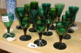 Sixteen assorted early 19th century green glass wines
