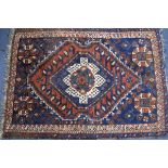 Two Caucasian red and blue ground rugs 125cm x 93cm, 179cm x 103cm