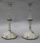 A pair of 18th century English enamel candlesticks 26cm.