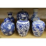 A 19th century Chinese blue and white prunus pattern vase and cover, 35cm., three other jars, two