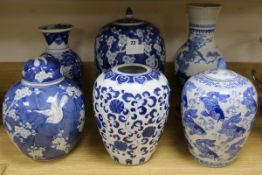 A 19th century Chinese blue and white prunus pattern vase and cover, 35cm., three other jars, two