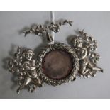 A late 19th/early 20th century American sterling silver Cherub watch holder, by Bigelo, Kennard &