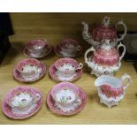 A Victorian nine piece porcelain teaset, painted with tulips