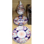 Six Imari plates, 21cm and a vase and cover, 27cm