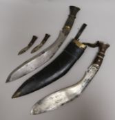 A kukri and scabbard, and another without scabbard, 42cm