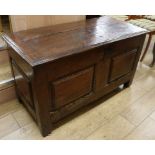 An 18th century oak and elm coffer, with candle box, W.116cm