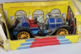 A boxed Schuco clockwork car and sundries