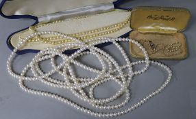 Two cultured pearl necklaces and a seed pearl necklace with diamond set clasp.