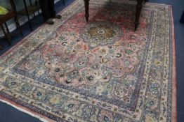 A Persian red ground carpet 371cm x 246cm