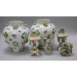 A pair of continental porcelain floral encrusted vases, 18cm, a pair of pot pourri vases, a jug