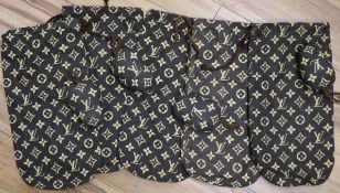 Five Louis Vuitton printed cotton shoe bags and two pairs of Louis Vuitton fabric shoe trees, c.