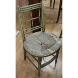 A set of five Regency style green painted salon chairs, with rush seats