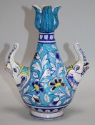 An Islamic fritware tulip vase, 24cm