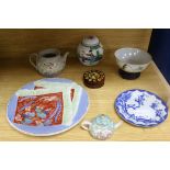 A small group of Chinese and Japanese ceramics including a miniature teapot, 6cm