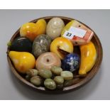 A group of hardstone model fruit and hand coolers, in a wooden bowl, 26cm