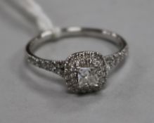 A modern Maple Leaf Diamonds 18ct white gold and diamond cluster dress ring retailed by