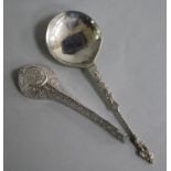 An Indian white metal pouring vessel and a continental apostle spoon.