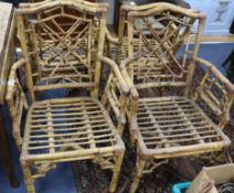 A set of eight rattan elbow chairs