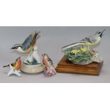 A Royal Worcester model of a grey wagtail, and three other bird figures