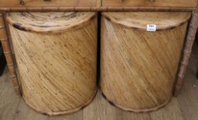 A pair of bamboo occasional tables, diameter 48cm H.56cm