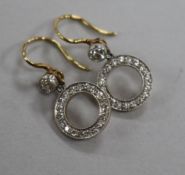 A pair of yellow metal and diamond set drop hoop earrings, overall 15mm.