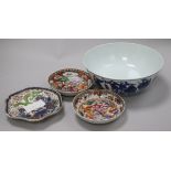 A Chinese blue and white bowl, and three assorted saucers, bowl diameter 20cm