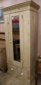 An Edwardian pine wardrobe, W.96cm