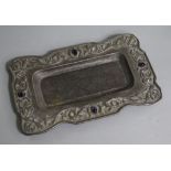 An early 20th century Arts & Crafts repousse white metal and cabochon amethyst set rectangular