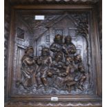 A Dutch style carved oak panel