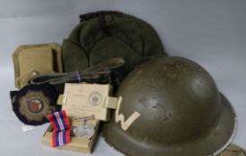 A British WW2 helmet, an army belt, a marching compass in case, a side cap,