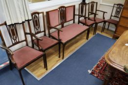 An Edwardian satinwood banded mahogany salon suite