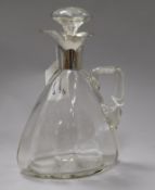 A George V silver mounted cut glass claret jug, 24cm