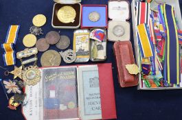 A box of assorted medallions, medal ribbons, etc.