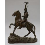 After Remington. A bronze group of a Native American warrior on horse back, signed in the bronze,