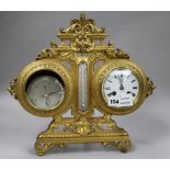 An Edwardian gilt brass combined desk timepiece, thermometer and barometer, height 36cm