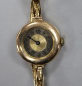 A lady's early 20th century 9ct gold Lanco wrist watch, on a 9ct gold flexible strap.