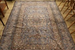 A Persian pale blue 'silky' carpet, 262 cm x 193 cm